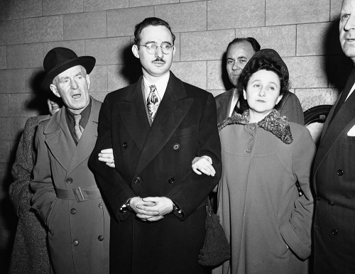 black and white photo of Julius and Ethel Rosenberg in custody